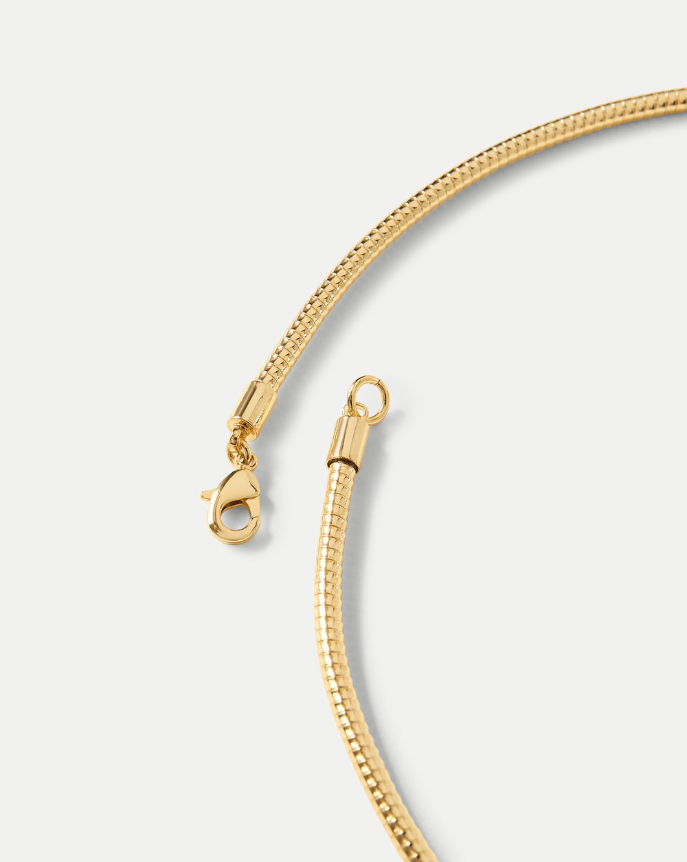 Gold Snake Chain Pendant Necklace in Clear/Gold